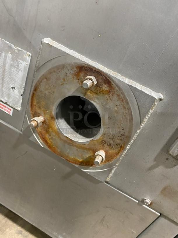 Biro commercial stainless steel electric meat mixer/grinder, freestanding, heavy-duty, on casters, visible wear and rust.