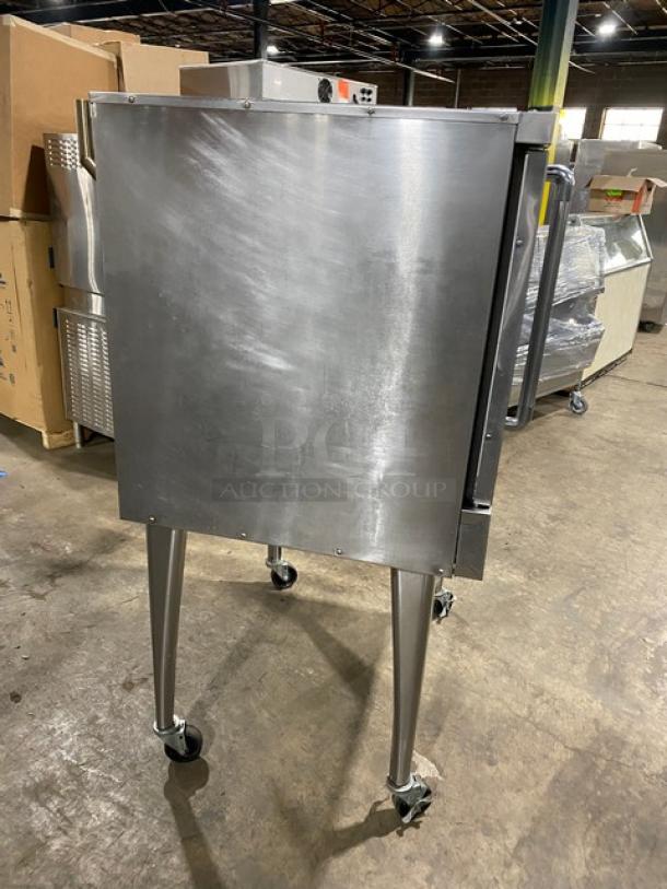 Imperial PCVG1 stainless steel single-stack convection oven on casters, natural gas powered, with wired oven rack.