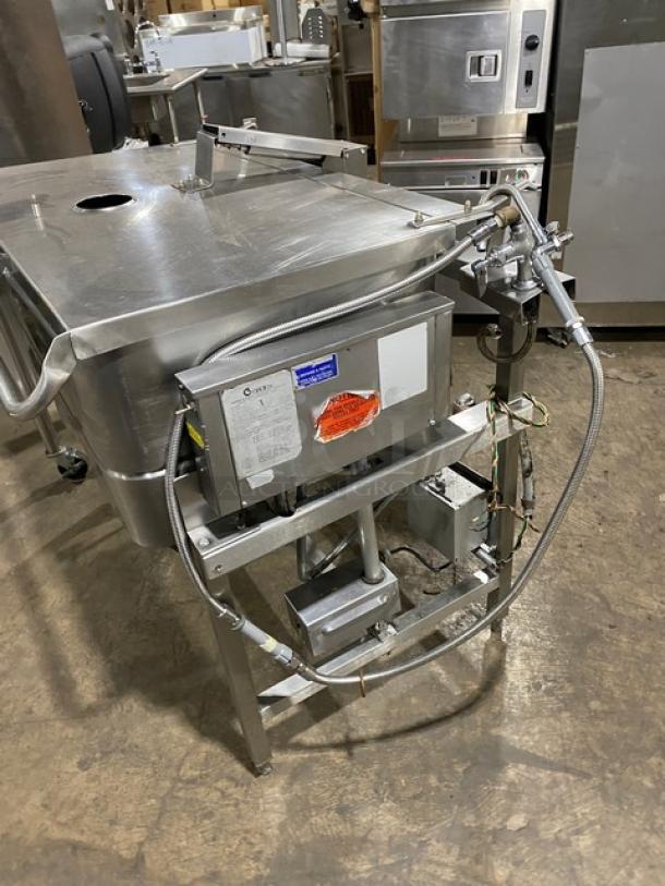Groen NHFPE4 Commercial Stainless Steel 40 Gal. Tilt Skillet/Braising Pan with single spout faucet, on legs, natural gas powered.