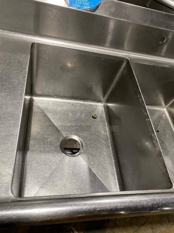 Wasserstrom commercial stainless steel 3-compartment sink with side drain boards on legs. Excellent condition.