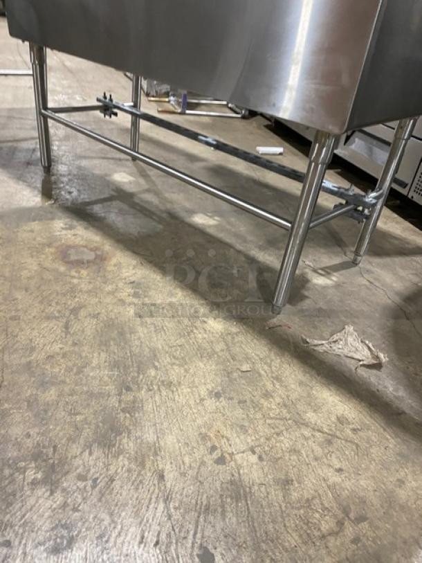 Wasserstrom stainless steel 3-compartment sink with left and right drain boards on legs. Ideal for commercial use.