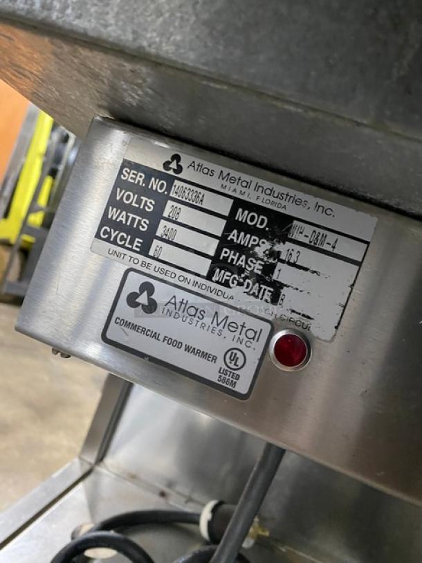 Atlas Metal WIH-D&M-4 commercial stainless steel 4-well steam table, electric, 208V, 1 phase, on casters, with sneeze guard.