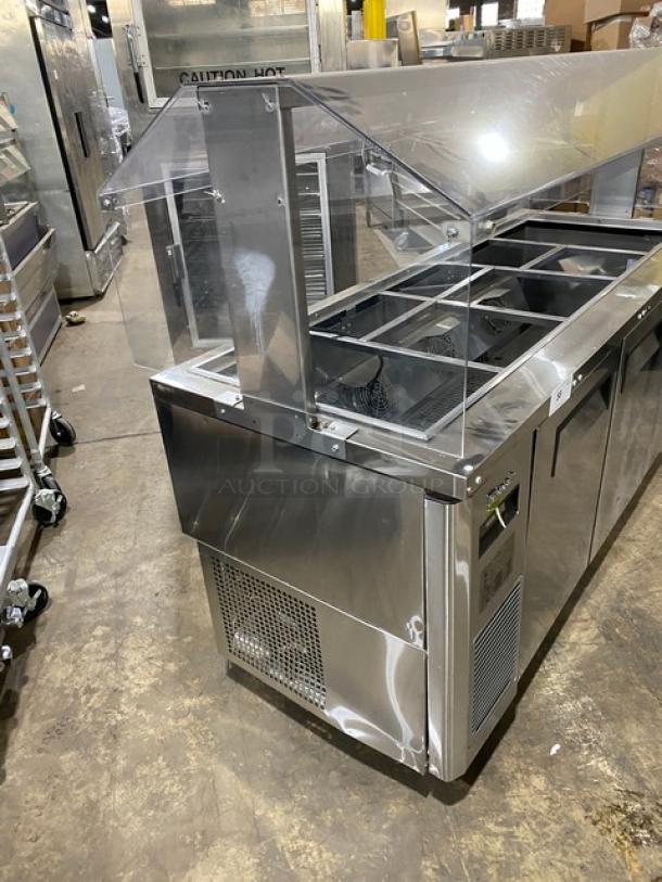 Turbo Air JBT-72-N stainless steel 3-door refrigerated buffet table with sneeze guard, poly-coated rack, on casters.