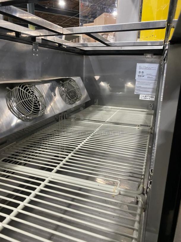 Turbo Air JBT-72-N stainless steel 3-door refrigerated buffet table with poly-coated rack and sneeze guard; model label visible.