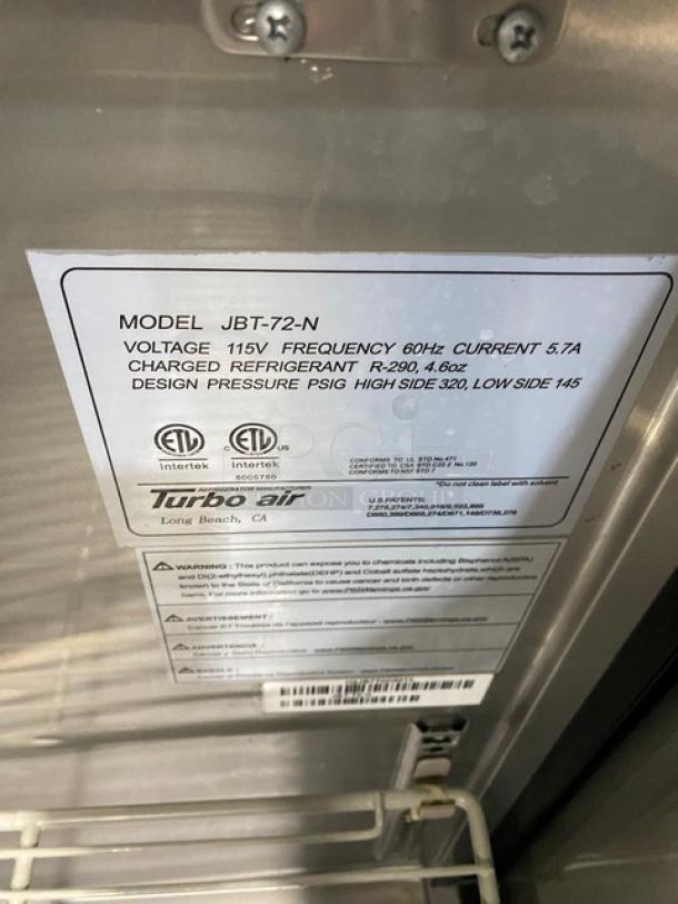 Turbo Air JBT-72-N commercial 3-door refrigerated buffet table with sneeze guard, poly-coated wire rack, on casters. 115V.