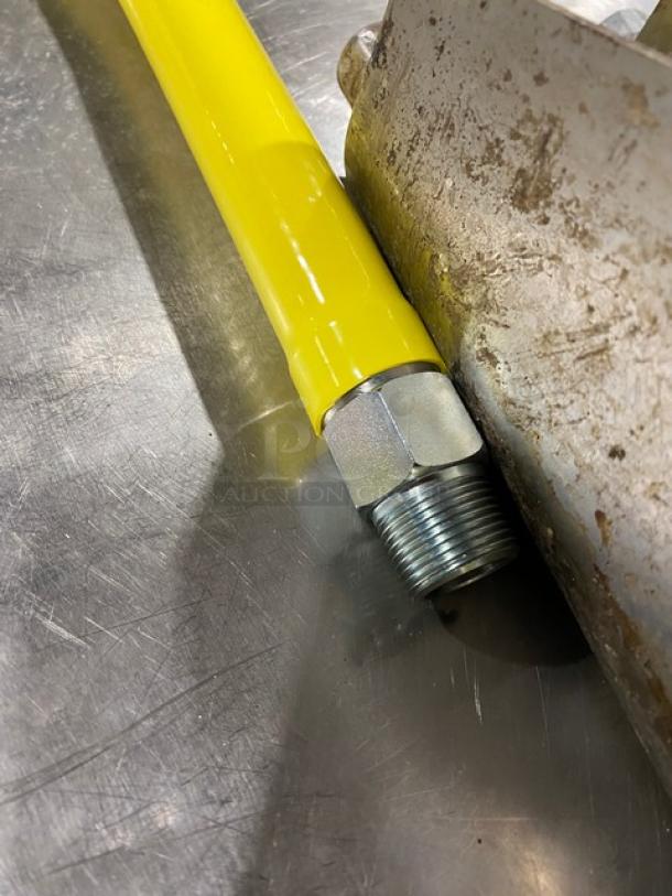 T&S Brass Safe-T-Link 48" gas hose, model HG6D48, bright yellow coating, new condition, quick-disconnect fitting.