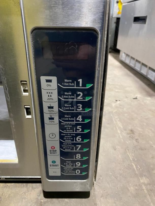 Menumaster RFS12TSW Commercial Microwave Oven, stainless steel, digital controls, 120V, buttons labeled for various heating options.