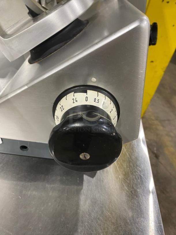 Bizerba SE12D heavy-duty deli meat slicer, electric-powered, countertop model with adjustable thickness knob, 120V.