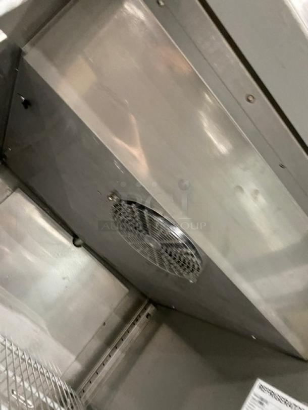 Hoshizaki commercial stainless steel reach-in merchandiser refrigerator interior. Poly coated wired rack visible. Model CR1S-FGECR.