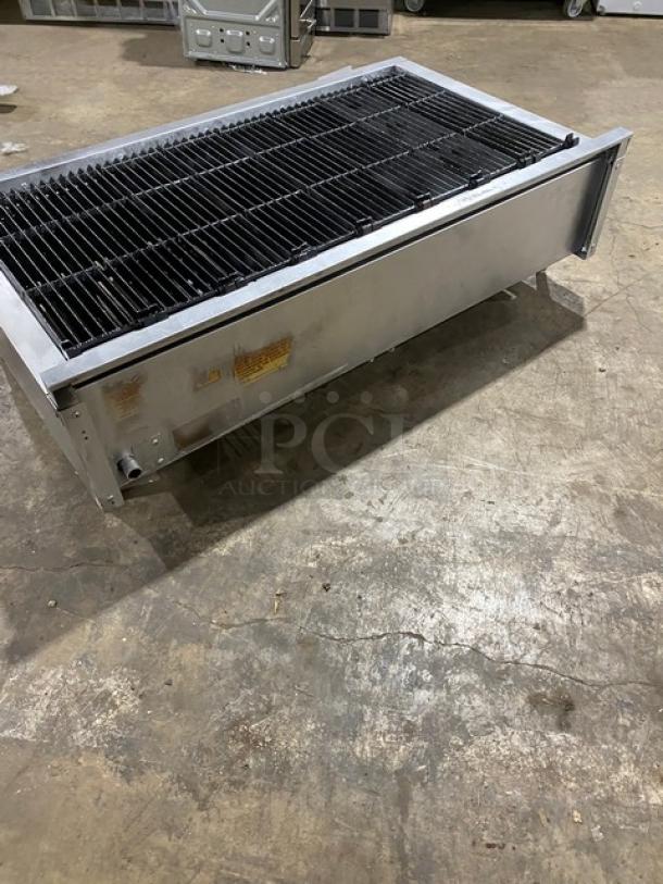 Vulcan VCCB471 commercial stainless steel countertop char broiler with cast iron grates, natural gas powered, on legs.