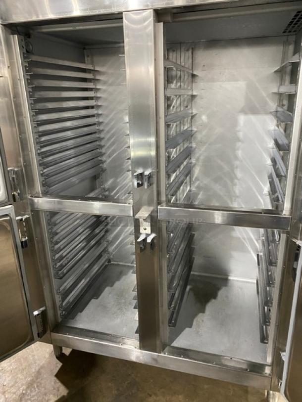 Traulsen commercial stainless steel refrigerator, double section, 4 half-doors, built-in pan slides, on legs, excellent condition.