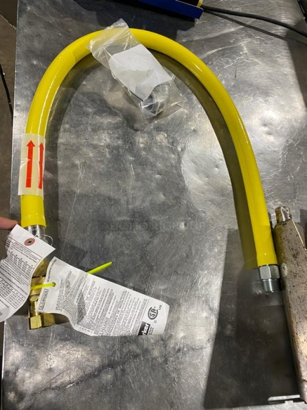 Brand new T&S Brass Safe-T-Link 48" gas connector hose, model HG-6D-48. Features quick-disconnect. Yellow with tags.