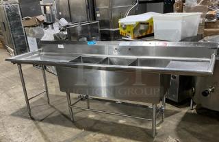 Wasserstrom stainless steel 3-compartment sink with left and right drain boards, on legs, in good condition. Ideal for commercial use.
