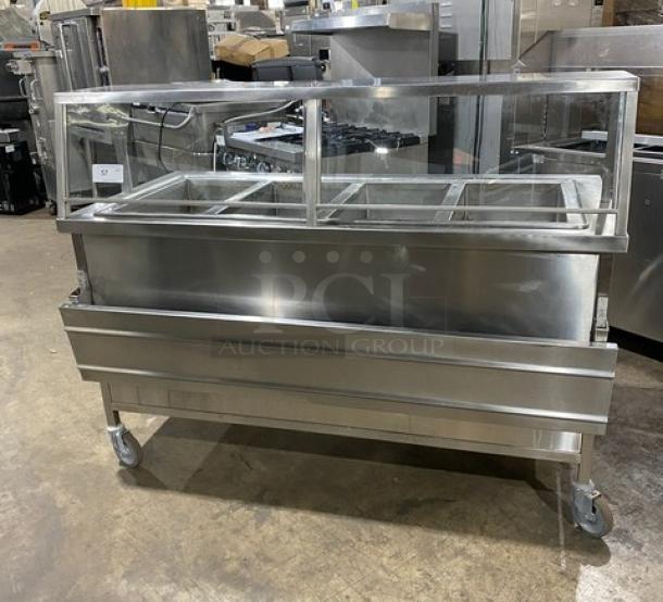 Atlas Metal WIHD&M4 stainless steel 4-well hot food steam table with sneeze guard, electric, 208V, on casters, excellent condition.
