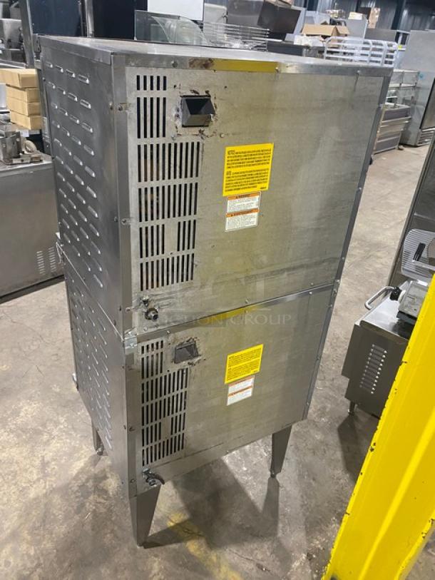 Vulcan stainless steel gas double convection oven, wired rack, on legs, with caution labels, visible venting.