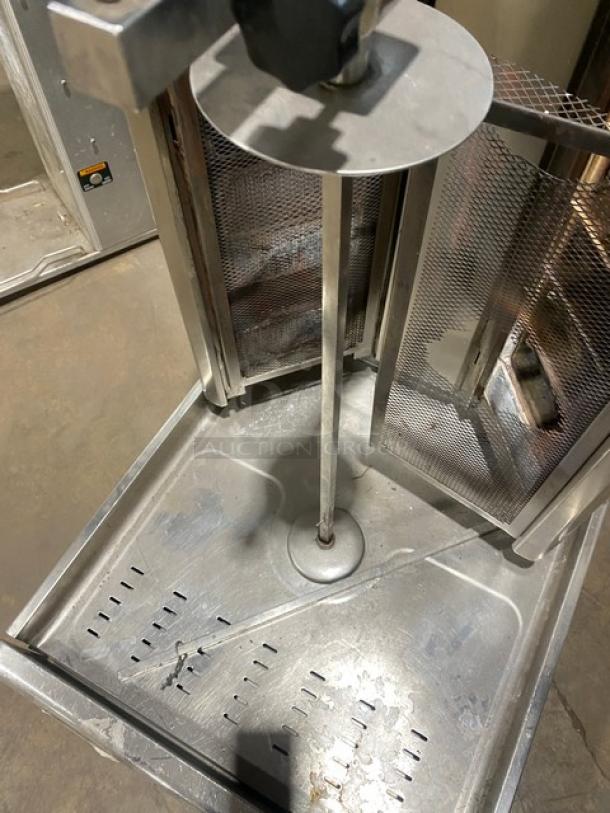 Visvardis DG12V commercial stainless steel gyro machine with 6 double burners, model 0377, on legs, in used condition.
