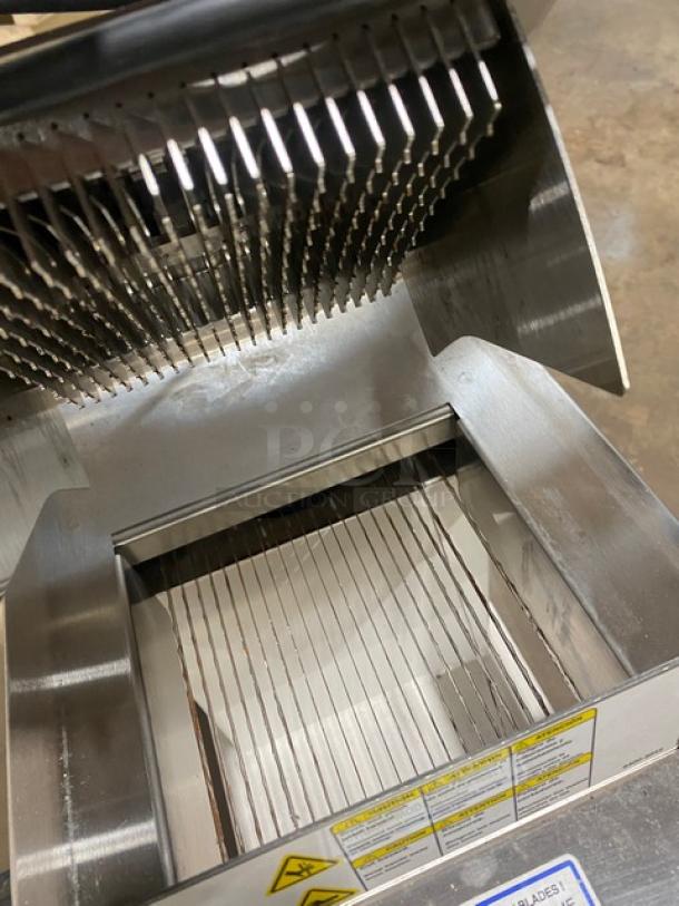 Oliver Model 738 countertop slicer, white powder-coated stainless steel, electric-powered, visible blade mechanism, excellent condition.