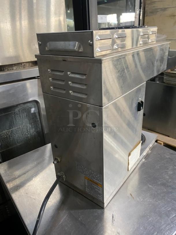 Bunn Axiom Series commercial coffee brewer, stainless steel, model AXIOM-35-2, with digital controls, warming plates, used condition.