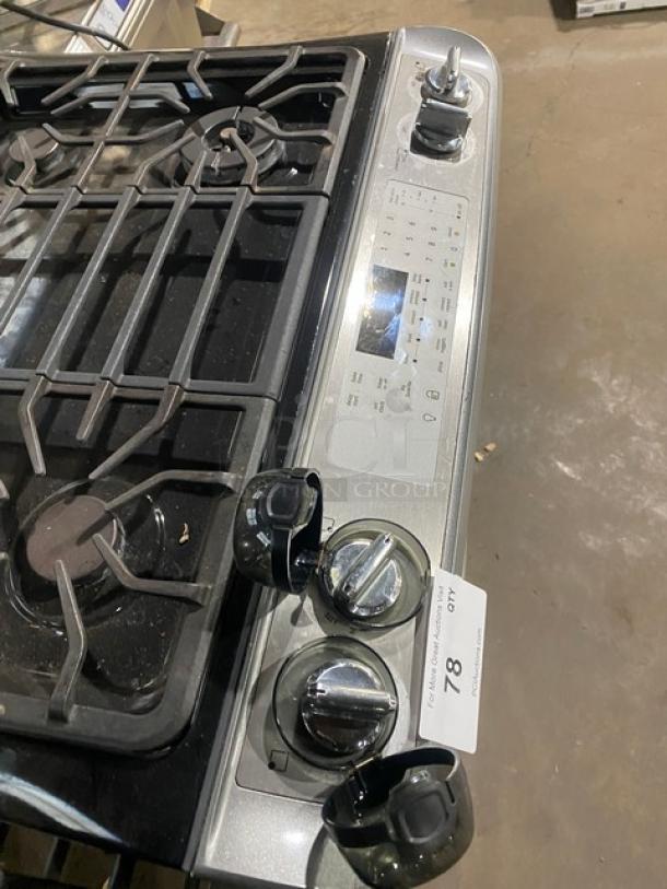 Frigidaire Professional Series stainless steel 4-burner gas range/oven, model FPGS3085KFH, with warming drawer and wired oven rack.