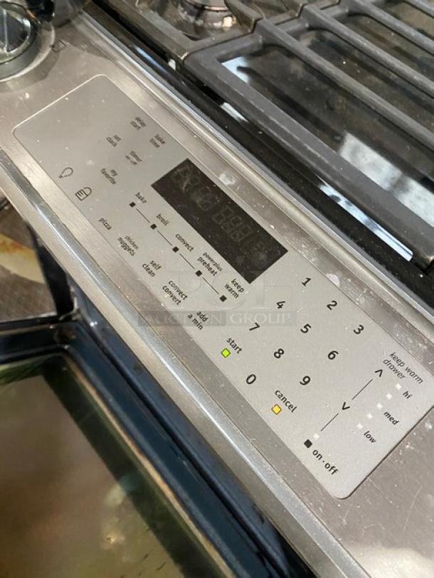 Frigidaire Professional Series stainless steel gas range with 4 burners, warming drawer, and wired oven rack. Model FPGS3085KFH.