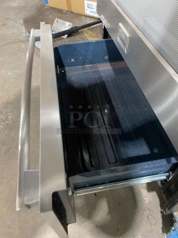 Frigidaire Professional Series stainless steel slide-in range/oven with open warming drawer. Model FPGS3085KFH.