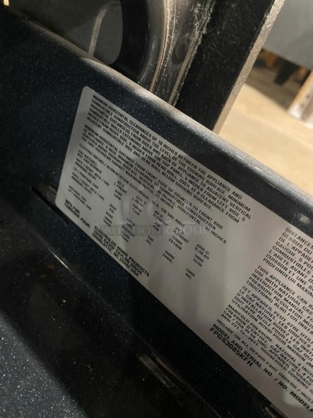 Frigidaire Professional Series stainless steel gas range/oven with 4 burners, warming drawer, and wired oven rack. Model FPGS3085KFH.