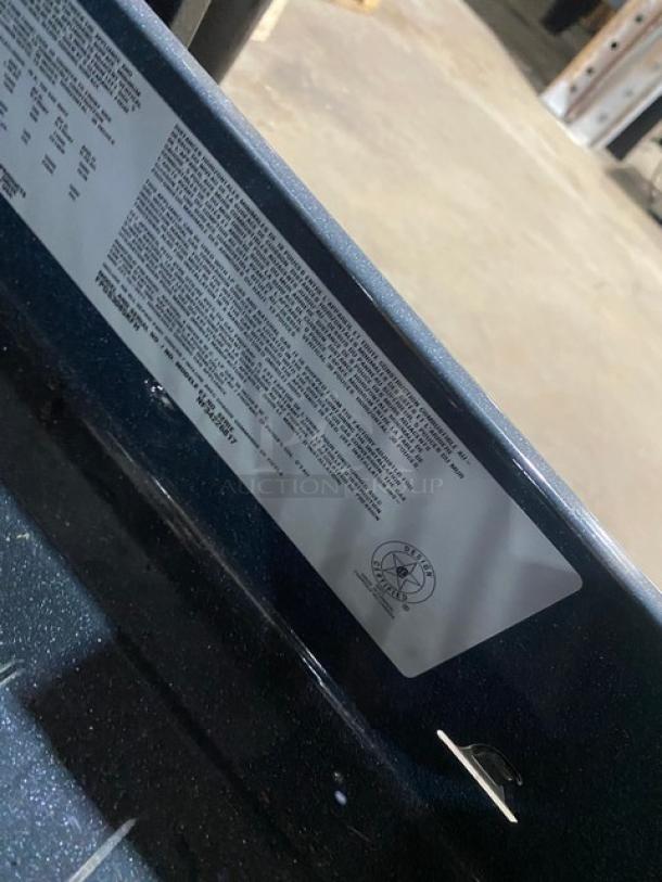 Frigidaire Professional gas range/oven, Model FPGS3085KFH, with 4 burners, warming drawer. Stainless steel. Serial NF34226817.