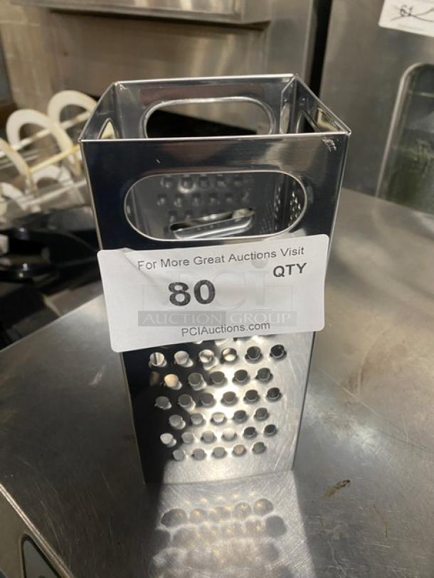 Commercial stainless steel 4-sided handheld box grater in excellent condition, featuring ergonomic handle. Auction label reads "80."