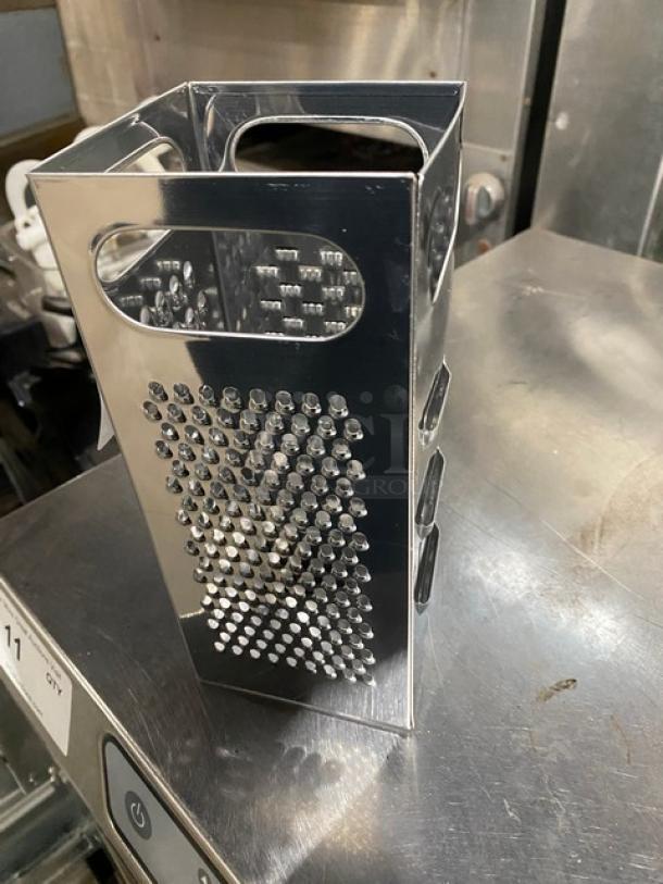 Commercial stainless steel 4-sided handheld box grater, features coarse, medium, fine, and slicing graters, excellent condition.