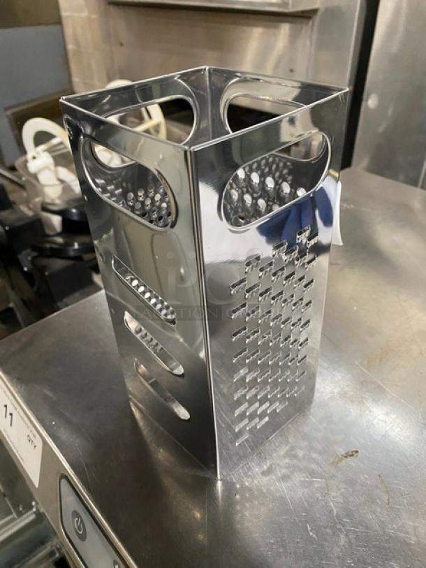 Stainless steel 4-sided handheld box grater, commercial-grade, with coarse, medium, fine, and slicing options, excellent condition.