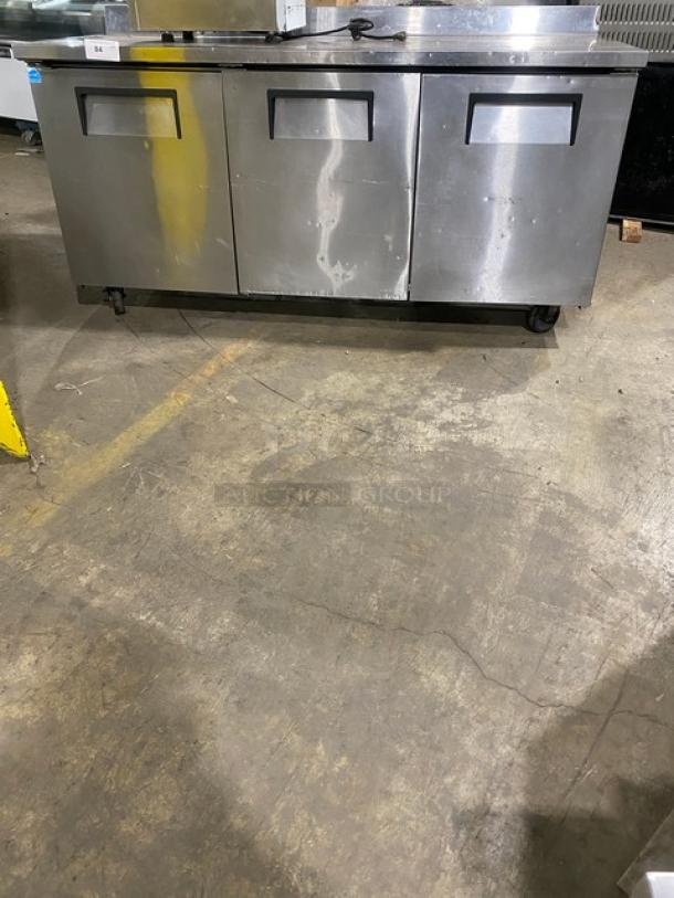 True TWT-72 commercial stainless steel 3-door worktop refrigerator, Energy Star certified, with upturned backsplash, on casters.