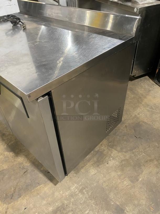 True Commercial Stainless Steel 3-Door 72" Worktop Refrigerator, Model TWT-72, Energy Star, with upturned backsplash, on casters.