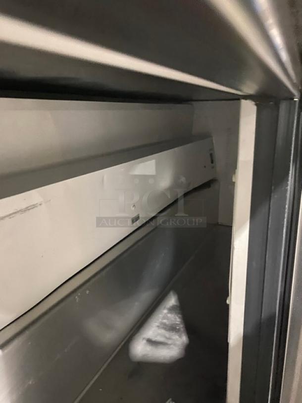 True TWT72 commercial stainless steel 3-door worktop refrigerator with upturned backsplash, Energy Star certified, 72", on casters.