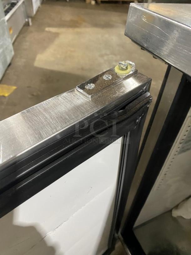 True TWT-72 commercial stainless steel worktop refrigerator, featuring a 3-door design, upturned backsplash, and caster wheels.