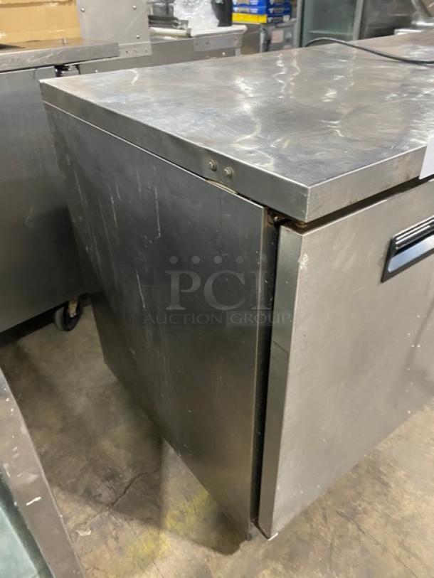 Maxx Cold X-Series MXCF60U 60" stainless steel worktop freezer with two doors. Features poly coated wired rack. Visible wear.