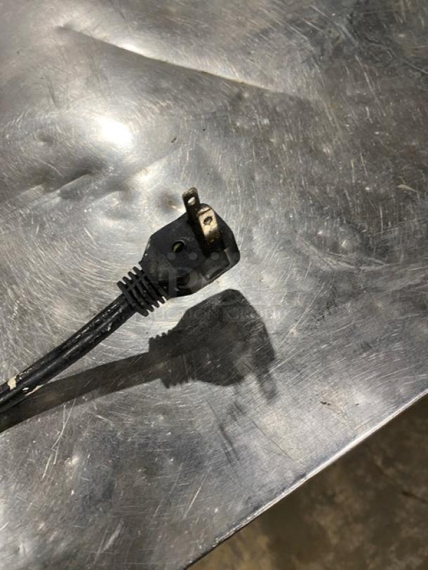 Maxx Cold X-Series stainless steel 2-door 60" worktop freezer, Model MXCF60U, featuring poly-coated wire rack, shown with power plug.