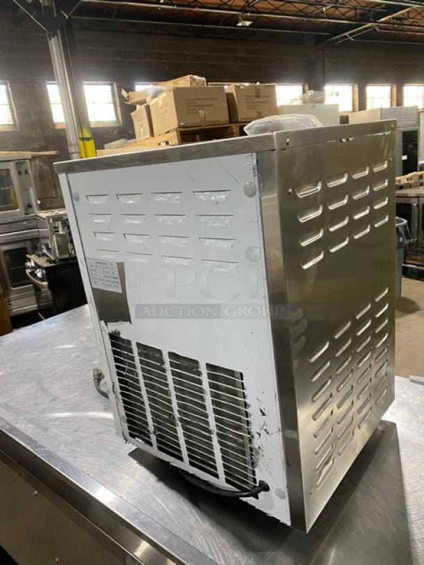 Cooler Depot BQL112Y stainless steel countertop ice cream batch freezer. Electric powered, 110V, on legs. Visible wear.