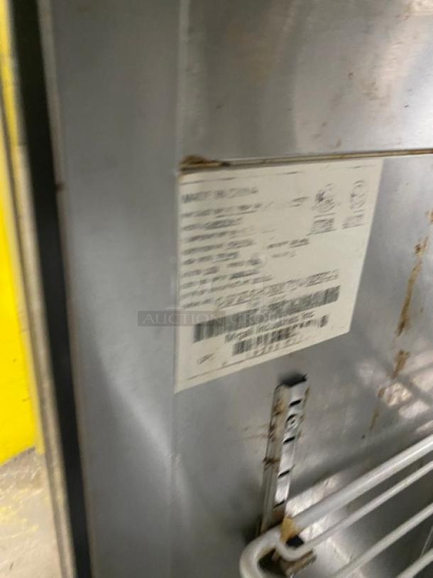 Migali stainless steel refrigerated prep table label, shows model and specifications. Includes poly-coated rack, on casters.