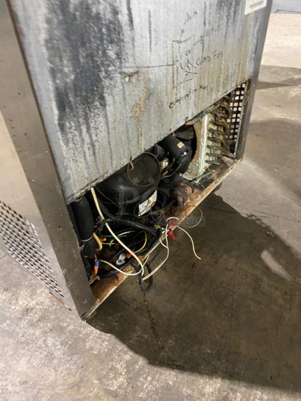 Migali stainless steel refrigerated prep table, single door, with cutting board, poly-coated rack, on casters, exposed wiring.