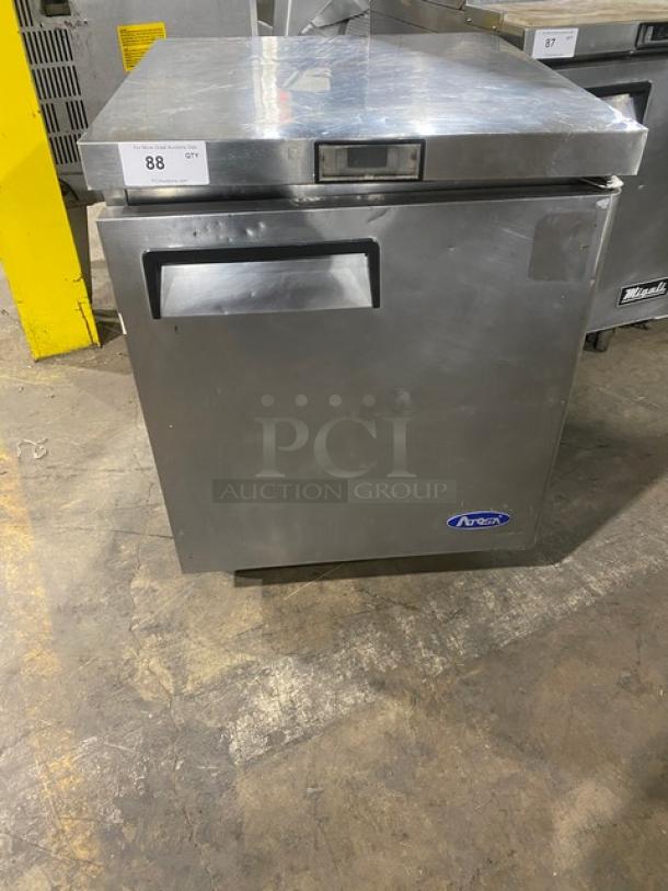 Atosa stainless steel single door undercounter worktop freezer with poly coated wired rack, 115V, on casters.