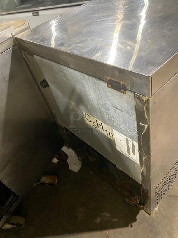 Atosa commercial stainless steel single door undercounter worktop freezer with poly coated wired rack, 115V, on casters.