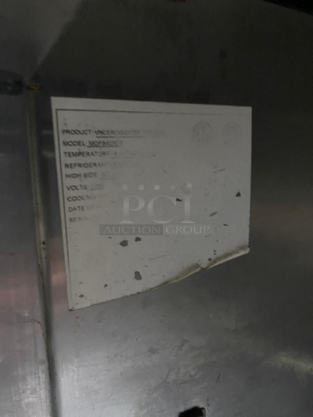Atosa commercial stainless steel undercounter freezer on casters; includes poly-coated wire rack. Shows specifications label.