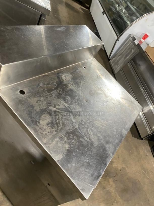 Commercial stainless steel enclosed cabinet, multi-tier dry worktop table with backsplash and rear shelving, used condition.