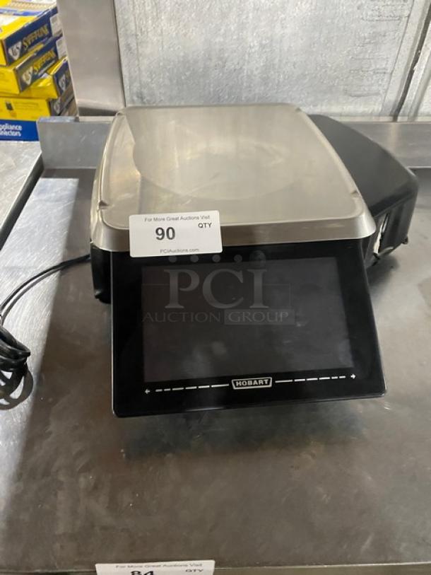 Hobart HTi-7LH4 commercial countertop price computing scale/printer combo with stainless steel worktop and dual display.