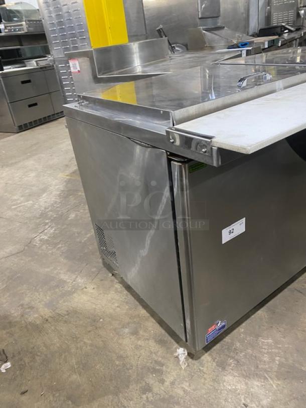 Turbo Air Super Deluxe Series 2-door refrigerated prep table, model TST60SD24N, stainless steel, with cutting board and rack.