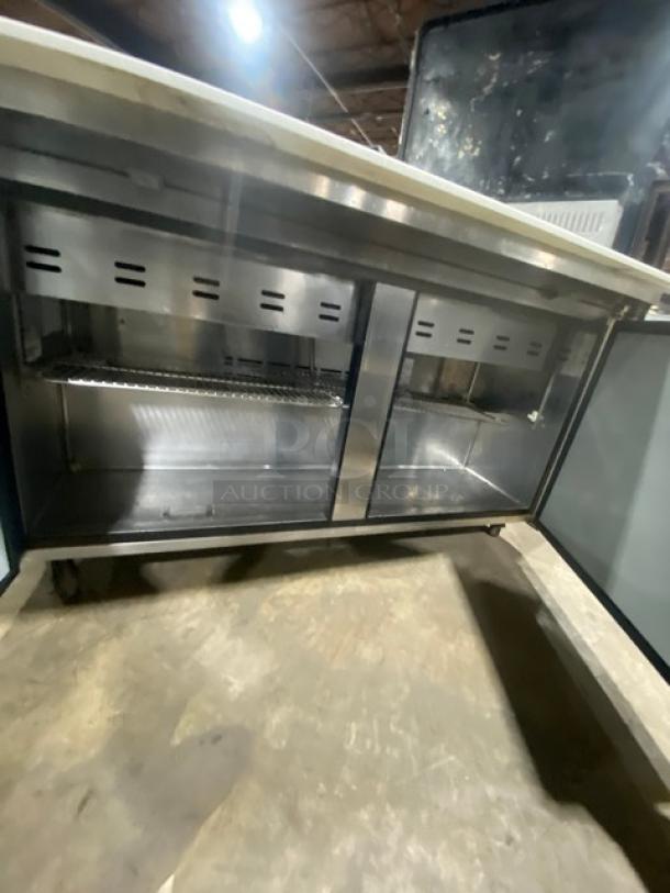 Turbo Air Super Deluxe 2-Door Refrigerated Prep Table, Model TST60SD24N, stainless steel, includes cutting board, chrome rack, on casters.