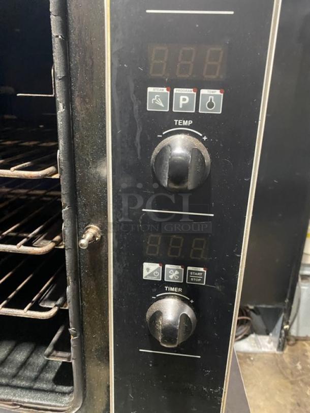 Moffat Turbofan Series stainless steel countertop convection oven with digital controls and wired rack. Excellent condition.
