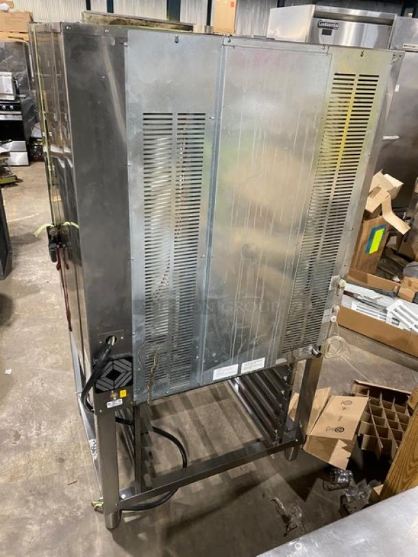 Axis commercial stainless steel electric combi oven with digital controls, wired oven rack, and 3-phase power, on legs.