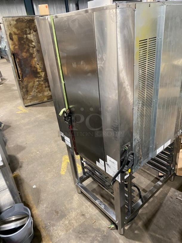 Axis stainless steel electric combi oven with digital controls, wired oven rack, 3-phase, on legs. Good condition. Labels visible.