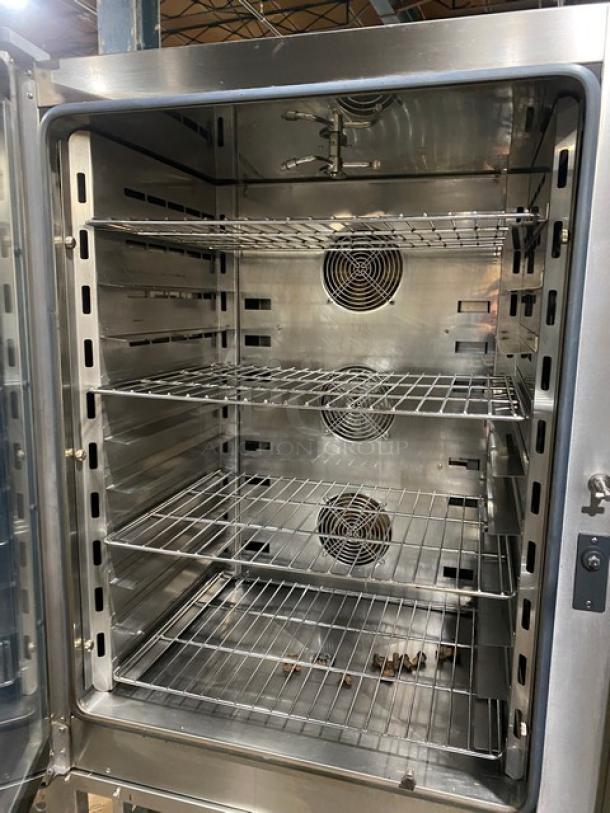 Axis stainless steel electric combi oven, digital controls, wired racks, 3 phase, on legs, excellent condition.